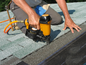 Gellings Roofing team in Sheboygan County securing shingles post-winter.