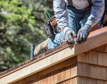 A close-up of roof flashing repair by a professional roofer in Manitowoc.