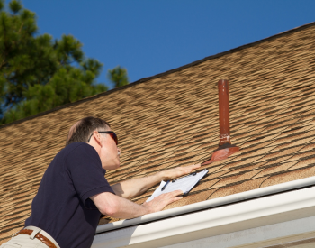Professional roof inspection for storm damage in Manitowoc County.